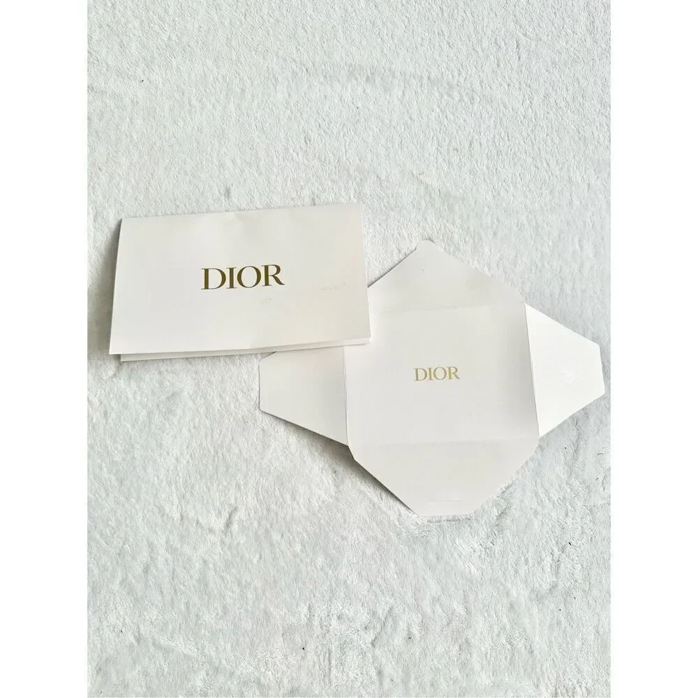 White and gold Dior envelope ￼